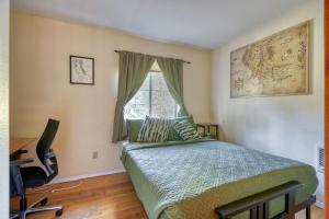 a bedroom with a bed and a desk and a window at Woodland Hideaway, Dog-Friendly, Hot Tub in Rhododendron +13 photos