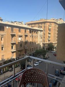 a chair sitting on the balcony of a building at Downtown Cairo Park Plaza Hotel in Cairo