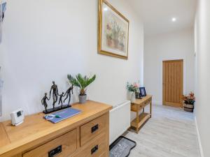 a home office with a desk and a table at Sea View Penthouse - Regency Mansion in Redcar