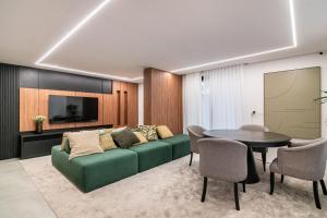 TV a/nebo společenská místnost v ubytování Modernidade no Batel | Suíte luxo
