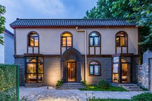 a house with its lights on at Beijing Magic Villa in Tuqiao