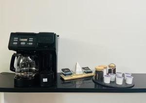 een koffiezetapparaat op een aanrecht bij Peaceful- King Beds- Attached Garage - Pet Friendly in Edmonton +19 foto's