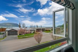 a window with a view of a street at Kinloch Lookout in Kinloch