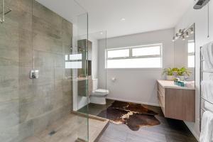 a bathroom with a glass shower and a toilet at Kinloch Lookout in Kinloch +35 photos