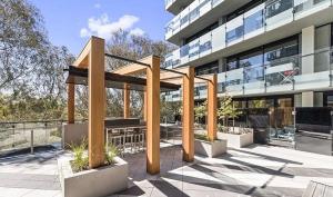 a building with a gazebo in front of it at VAQUAY Embassy In Abbotsford in Melbourne
