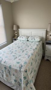 a bedroom with a bed with two pillows on it at Holgate Ocean Front Duplex 2Nd Fl 14018 in Holgate