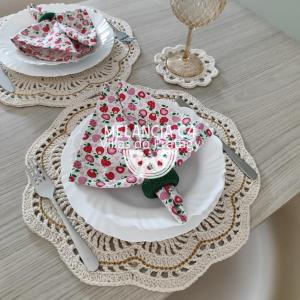 a table with two plates with napkins on them at Bangalô Melancia C4 in Maceió