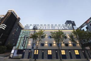 a hotel ryan sign on the front of a building at Gijang Ryan Hotel in Busan