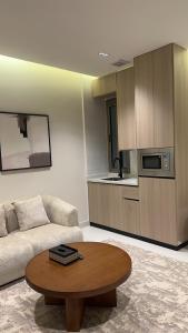 a living room with a couch and a coffee table at فندق لوسكا in Abha