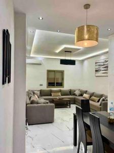 a living room with a couch and a table at Perfect Studio Apartment La Cañada in Fès