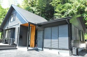 a small house with a gambrel roof at THE LUGNT - Luxurious private villa surrounded by nature - 
