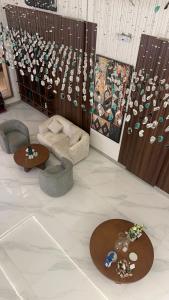 a living room with two tables and a couch at فندق لوسكا in Abha +31 photos
