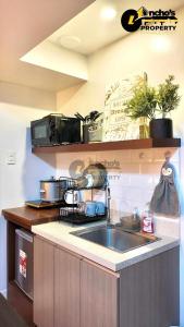 a kitchen with a sink and a counter top at Cheryl queen studio in Cebu City