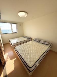 Ένα ή περισσότερα κρεβάτια σε δωμάτιο στο Private villa with a dog run and ocean view