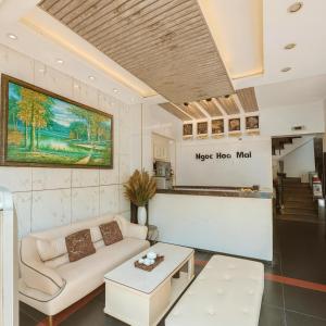 a living room with a couch and a table at Ngọc Hoa Mai Hotel in Ho Chi Minh City