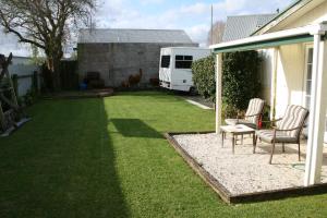 Zahrada ubytování Hosts on the Coast Sandy Paws + 19 fotografií