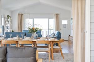 a dining room with a table and chairs at Crestmount in Milton