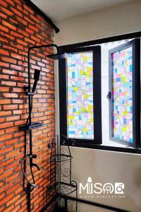 a fire hydrant next to two windows with stained glass at Chloe's Room 