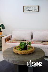 a living room with a table and a couch at Chloe's Room  +1 photo