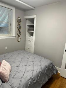 a bedroom with a bed in a room at The Lyons' Den in Chicago