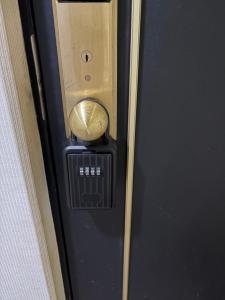 a close up of a door with a door knob at フューデイズコンドミニアム定山渓211号室(最大5名まで） in Jozankei