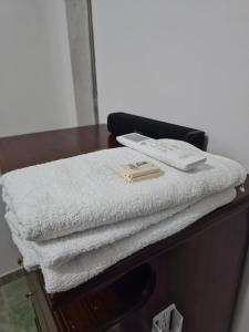 a pile of towels sitting on top of a table at La Tribuna Lounge in Valledupar +9 photos