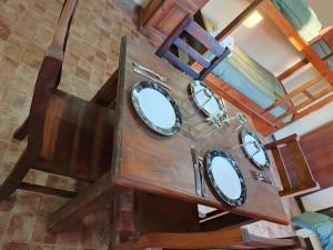 an overhead view of three mirrors in a wooden dresser at My Soul in Camet Norte