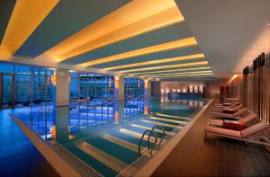 a large swimming pool in a hotel lobby at Hyatt Regency Guiyang in Guiyang