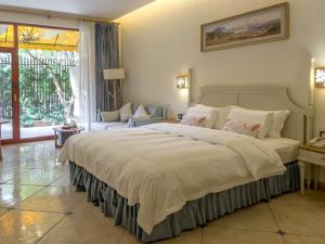 Postel nebo postele na pokoji v ubytování Kangman Hot Spring Resort Hotel + 147 fotografií