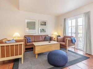a living room with a couch and a table at Luxury Retreat in Blavand - By Traum Ferienwohnungen in Blåvand