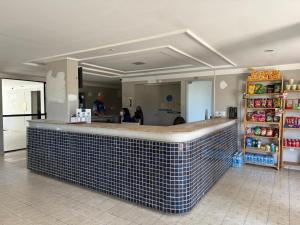 a bar in a store with a tile counter at 509 Flat praia piscina barzinho Intermares in Cabedelo
