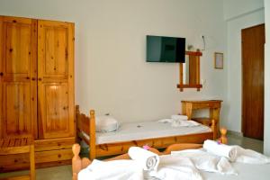 Postel nebo postele na pokoji v ubytování Aiolos House