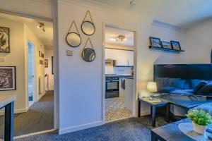 a living room with a couch and a table in a room at 2 BR House By Eason Stays Short Lets & Serviced Accommodation Chester With Free Parking in Chester