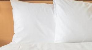 a white pillow sitting on top of a bed at Futami Onsen Hotel Seikai in Futami +120 photos