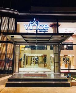 a building with a sign on the front of a store at Vince Sakon in Sakon Nakhon
