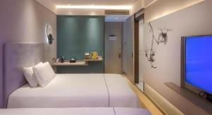 TV a/nebo společenská místnost v ubytování Magnotel Hotel Shiyan Wuyan Pedestrian Street