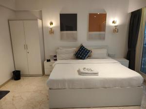 Ένα ή περισσότερα κρεβάτια σε δωμάτιο στο Anya 2BHK Near BKC - Modern, Calm & Connected +21 φωτογραφίες