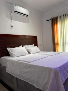 Ένα ή περισσότερα κρεβάτια σε δωμάτιο στο Villa Heavenora