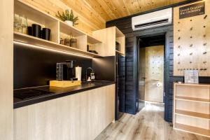 a kitchen with a counter with a coffee maker at Smoky Nook Soak and Smores Getaway in Cosby +10 photos