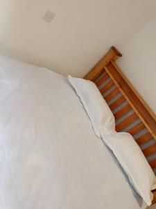 Postel nebo postele na pokoji v ubytování Pent House + 1 fotografie