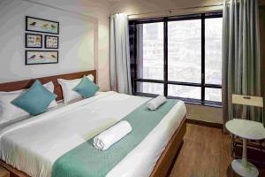 Ένα ή περισσότερα κρεβάτια σε δωμάτιο στο Sunbright Hotel