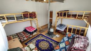 a room with two bunk beds in a room at Serenity Stay Rangrik in Kaza