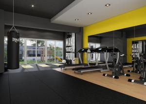 a gym with treadmills and cardio equipment in a room at L'Aurora Apart in Estación Pamplona