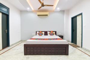 Ένα ή περισσότερα κρεβάτια σε δωμάτιο στο FabHotel Supreme Stay