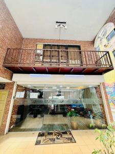 arium of a building with a balcony on top of it at J Hotel Bukit Bintang in Kuala Lumpur