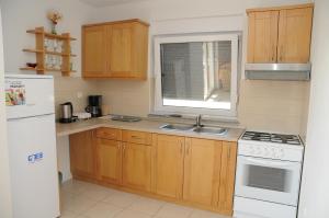 Kuchyň nebo kuchyňský kout v ubytování Apartmani Višnjić