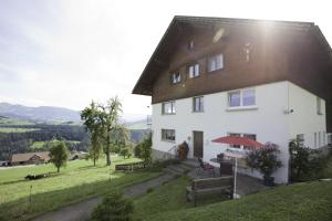 a large white house on top of a hill at Ferienwohnung Panorama in Doren
