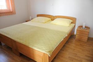 Postel nebo postele na pokoji v ubytování Apartmani Višnjić
