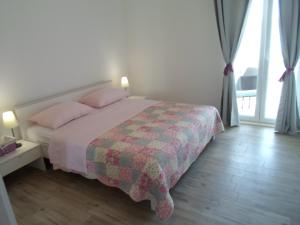 Postel nebo postele na pokoji v ubytování Apartments Barić Kučište
