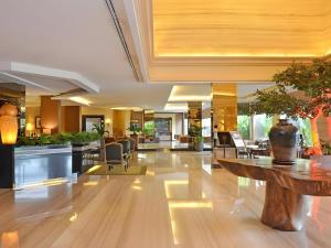 a lobby with a vase on a table at The Axana Hotel in Kampungdurian +191 photos